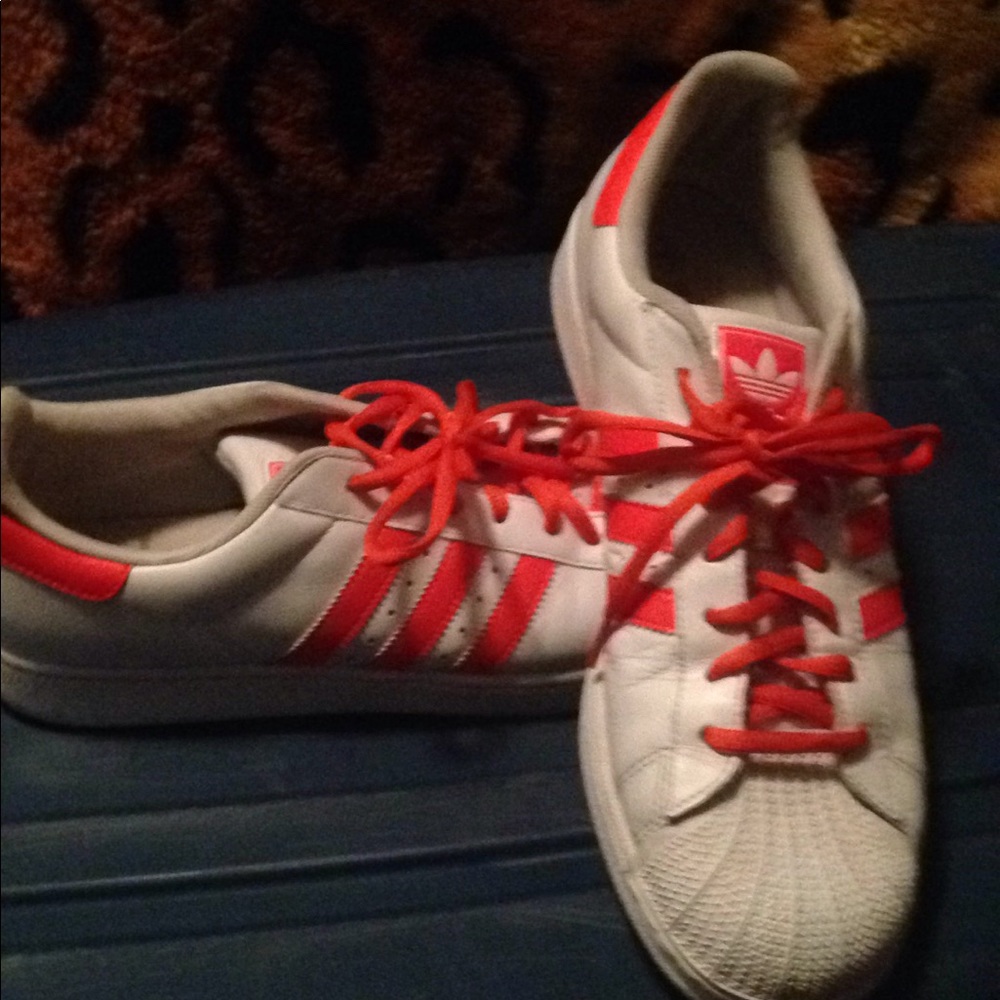 Adidas superstars. White leathe orange stripes